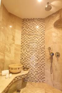 a bathroom with a shower and a sink at Orucoglu Oreko Hotel in Manisa
