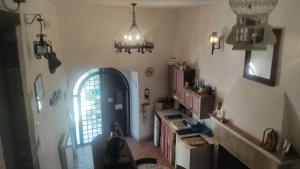 a kitchen with a sink and a window in a room at Guesthouse Runcini in Ferentillo