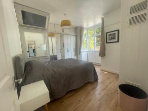 a bedroom with a bed and a window at Cozy bungalow in great location 