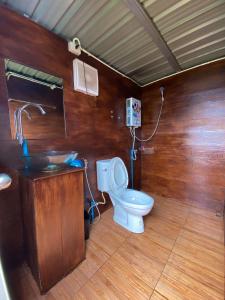 a bathroom with a toilet and a sink at Mon Jam Memory Camp in Mon Jam