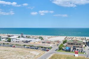 an aerial view of a parking lot next to the ocean at Ena Sunrise Summerland in Mamaia