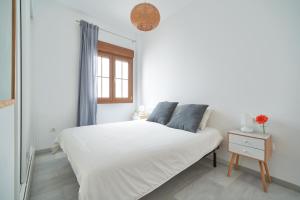 Posteľ alebo postele v izbe v ubytovaní APARTAMENTO EN EL CENTRO, TRANQUILO Y LUMINOSO