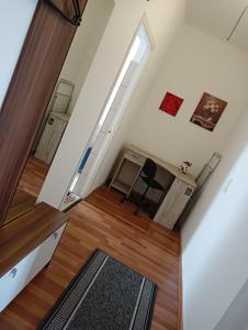 an attic room with a desk and a window at Stella s Monteurswohnungen in Werdau