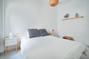Łóżko lub łóżka w pokoju w obiekcie APARTAMENTO EN EL CENTRO, TRANQUILO Y LUMINOSO