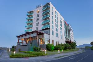 a hotel with a building on the side of a street at Sheraton San Jose Hotel, Costa Rica in San José