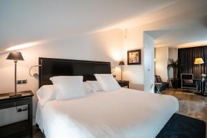 Postel nebo postele na pokoji v ubytování Grand Hotel Don Gregorio