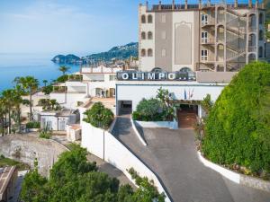 a view of a city with a building at Hotel Olimpo le Terrazze in Letojanni