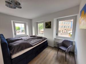 Postel nebo postele na pokoji v ubytování City-Apartments direkt am See - SEEBLICK!