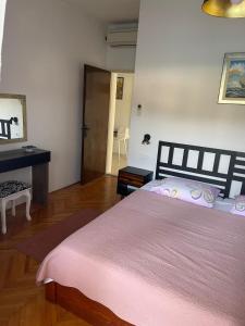 Postel nebo postele na pokoji v ubytování Makjanic Apartment