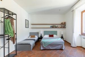 Posteľ alebo postele v izbe v ubytovaní iFlat Pantheon's roomy and friendly apartment