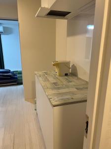 Una cocina o kitchenette en 熱海温泉　実の別荘
