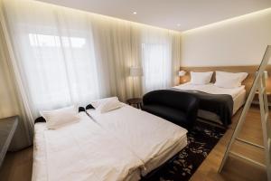 Letto o letti in una camera di PM & Vänner Hotel