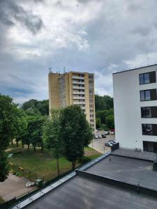 a view of a building from the roof of a building at Prie Vilneles Apartment in Vilnius +6 photos