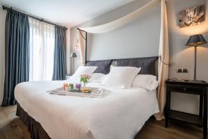 Postel nebo postele na pokoji v ubytování Grand Hotel Don Gregorio