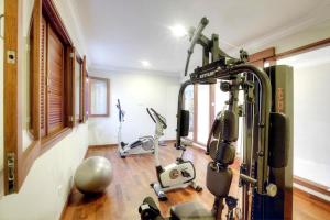 a gym with two exercise bikes in a room at Seminyak Lagoon All Suites Hotel in Seminyak