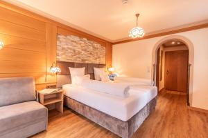 Postelja oz. postelje v sobi nastanitve Hotel Garni Apart TINA