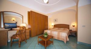 Postel nebo postele na pokoji v ubytování Hotel Ambasciatori