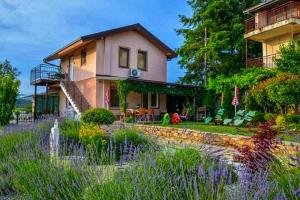 a house with a garden in front of it at Villa Silva in Ohrid