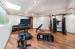 a room with a gym with tread machines at Leonardo Boutique Hotel Krakow City Center in Krakow