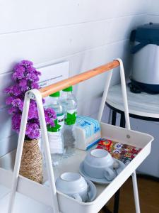 a white cart with flowers and other items on it at Mon Jam Memory Camp in Mon Jam