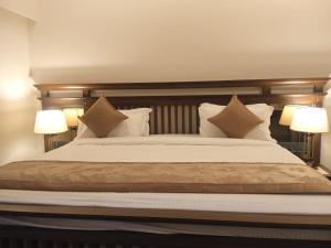 Ένα ή περισσότερα κρεβάτια σε δωμάτιο στο UVA Sands Beach Resort