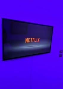 a sign that says netflix on a purple background at Salamis Luxury Escape in Salamina