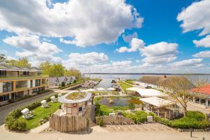 an aerial view of a marina with buildings and a lake at Appartements "Zum Leuchtturm" Hafen Rankwitz Insel Usedom in Rankwitz