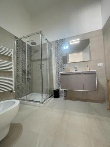 a bathroom with a shower and a toilet and a sink at Terra De Mare in Palmariggi +92 photos