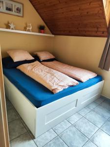 Posteľ alebo postele v izbe v ubytovaní Szigeti Apartmanház