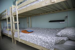 a bedroom with two bunk beds in a room at Hostel Dostoevsky Tyumen in Tyumen