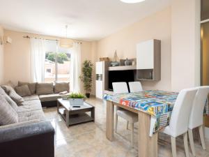 a living room with a table and a couch at Live Basilica Candelaria Beach & Balcony in Candelaria