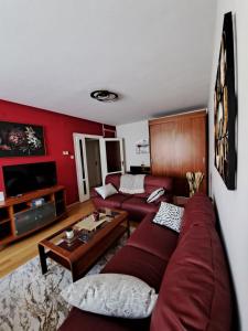 a living room with a couch and a table at Apartman Iadera in Zadar