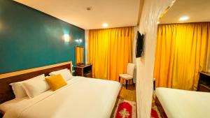 Łóżko lub łóżka w pokoju w obiekcie Hôtel Belle Vue et Spa