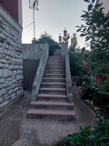 a set of stairs leading up to a building at Apartment Božava - Nena in Božava