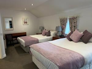 Letto o letti in una camera di Leixlip Manor Hotel