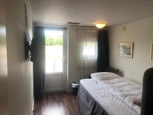 Voodi või voodid majutusasutuse Skulesjön Hotell toas