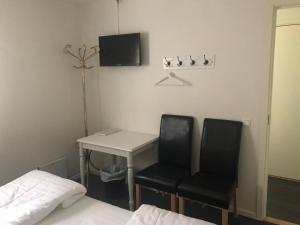 TV a/nebo společenská místnost v ubytování Skulesjön Hotell + 10 fotografií