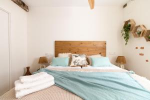 Łóżko lub łóżka w pokoju w obiekcie Salazar by Staynnapartments