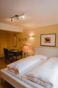 Postel nebo postele na pokoji v ubytování Hotel Stadtresidenz