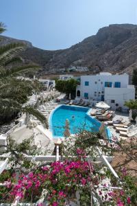 a view of the pool at a resort with pink flowers at Hotel Matina in Kamari