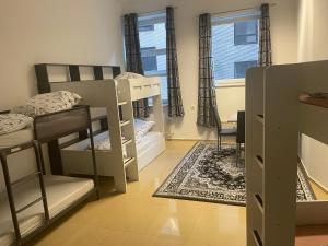 a dorm room with bunk beds and a window at Cityapartment bei Hauptbahnhof in Bremen +10 photos