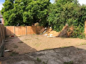 a backyard with a fence and a yard with trees at Immaculate 3-Bed House in Nottingham in Nottingham