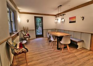 a dining room with a table and chairs at Fewo 6 - Residenz Schauinsland - mit Sauna, Todtnauberg, bei Feldberg in Todtnauberg