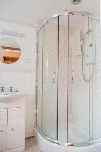 a bathroom with a shower and a sink at The Talbot Arms in Lyme Regis