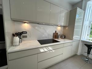 A kitchen or kitchenette at Principal Apartments - Crown Circus Duplex Apartment