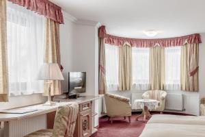 TV a/nebo společenská místnost v ubytování Hotel Alpenland