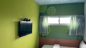 TV o dispositivi per l'intrattenimento presso Ye Yuan Star Homestay