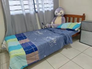 Postel nebo postele na pokoji v ubytování S99 HOMESTAY KUDAT
