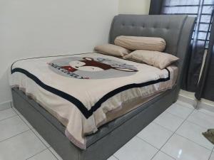 Postel nebo postele na pokoji v ubytování S99 HOMESTAY KUDAT