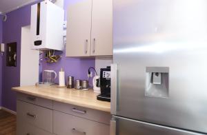 Kuchyňa alebo kuchynka v ubytovaní Apartament Lawendowy